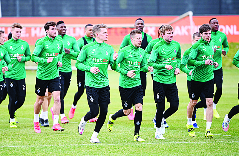 MOENCHENGLADBACH: Moenchengladbach's players take part in a training session on the eve of the UEFA Champions League, last 16, first-leg football match Borussia Moenchengladbach v Manchester City in Moenchengladbach, western Germany yesterday. - AFPn