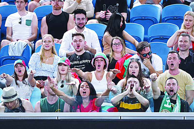 MELBOURNE: Fans of Bulgaria's Grigor Dimitrov cheer him on against Australia's Alex Bolt during their men's singles match on day three of the Australian Open tennis tournament in Melbourne yesterday. - AFPn