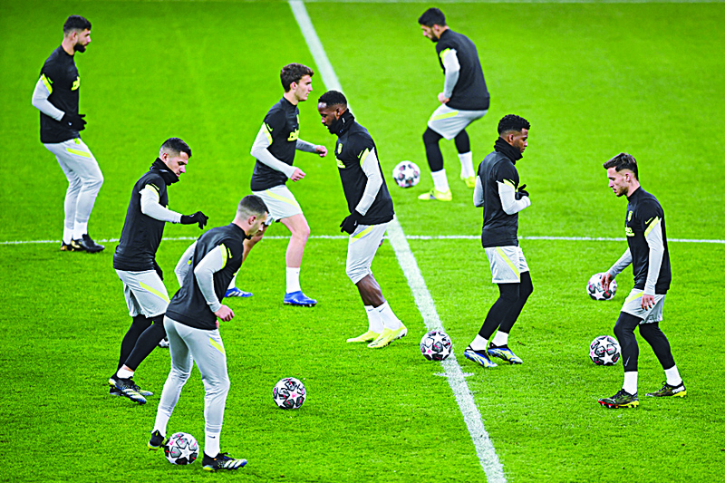 BUCHAREST: Atletico players attend a training session on the eve of the UEFA Champions League round of 16 first leg football match between Club Atletico de Madrid and Chelsea at the Arena Nationala stadium in Bucharest yesterday. - AFPn