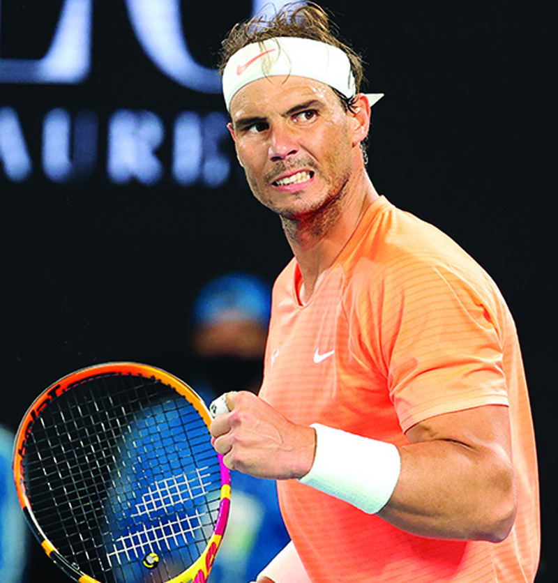 MELBOURNE: Spain's Rafael Nadal celebrates after winning against Britain's Cameron Norrie during their men's singles match on day six of the Australian Open tennis tournament in Melbourne yesterday. – AFPn