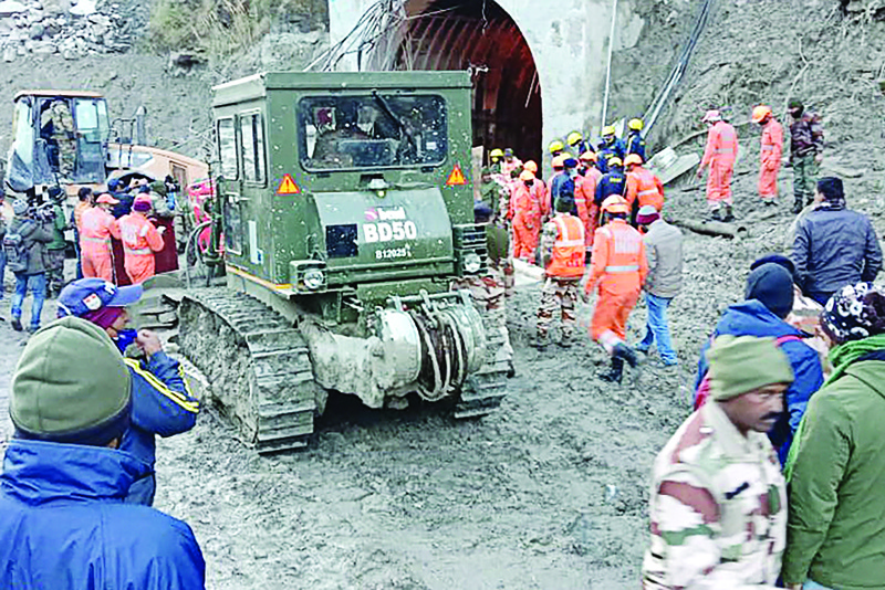 This handout photo taken yesterday and released by the Indo-Tibetan Border Police (ITBP) shows members of the Indo-Tibetan Border Police (ITBP) during a rescue operation after a broken glacier caused a major river surge that swept away bridges and roads, at a tunnel near Tapovan dam in Chamoli district of Uttarakhand. - AFPn