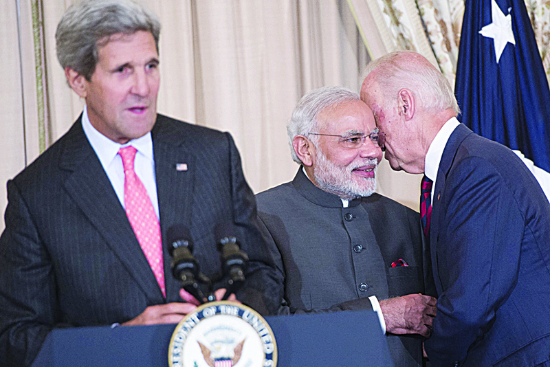 WASHINGTON, DC: In this file photo taken on September 30, 2014, US Vice President Joe Biden speaks with Indian Prime Minister Narendra Modi alongside US Secretary of State John Kerry during a luncheon at the US State Department in Washington, DC. – AFPn