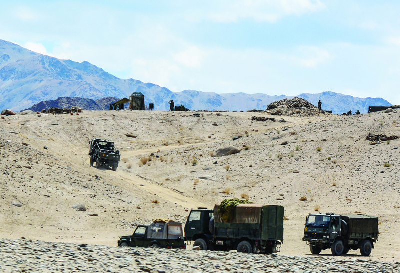 In this file photo taken on July 4, 2020 Indian army soldiers drive vehicles along mountainous roads as they take part in a military exercise at Thikse in Leh district of the union territory of Ladakh. - AFPn