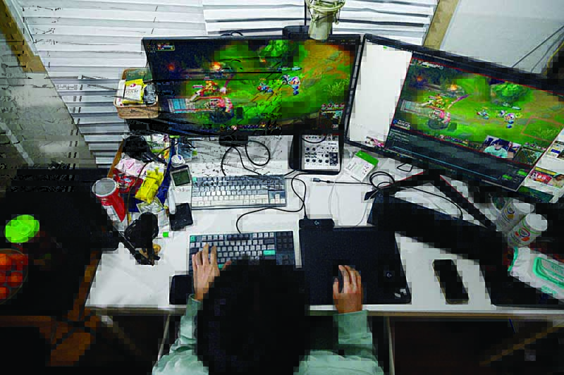 South Korean gamer Kim Min-kyo streaming computer games at his home near Anyang south of Seoul.