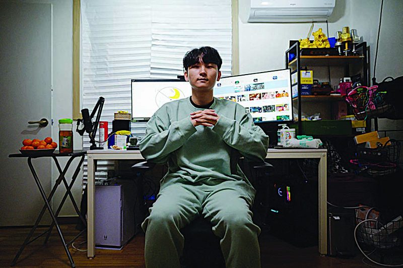 South Korean gamer Kim Min-kyo posing for a photo at his home near Anyang south of Seoul. —AFP photos