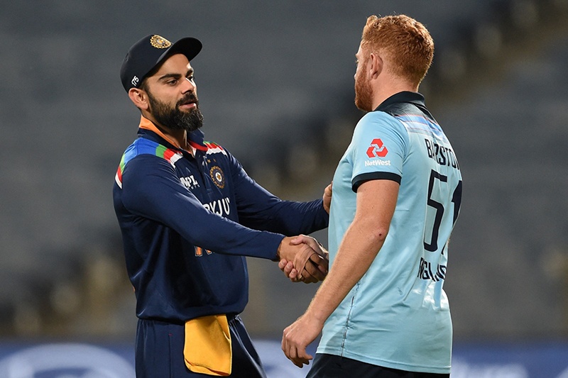 PUNE: India’s captain Virat Kohli shakes hands with England’s Jonny Bairstow after the second one-day international (ODI) cricket match between India and England at the Maharashtra Cricket Association Stadium on March 26, 2021. – AFP