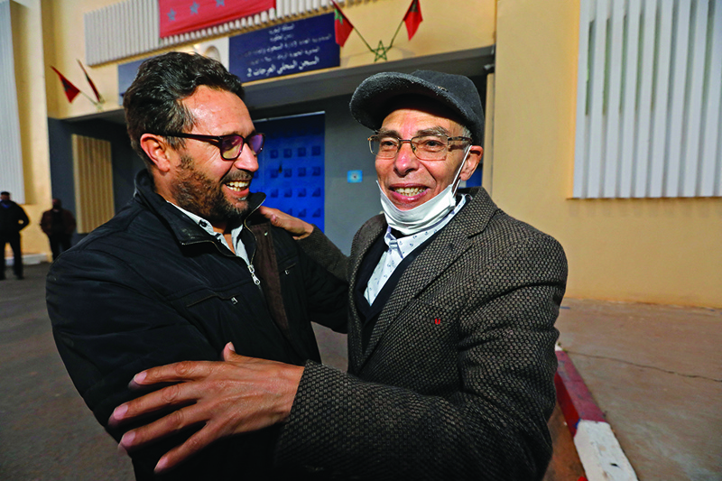 RABAT: Moroccan historian and rights activist Maati Monjib (right), who was on hunger strike for 19 days, is embraced by a man upon his release from El Arjate prison near the capital Rabat on Tuesday. - AFPn