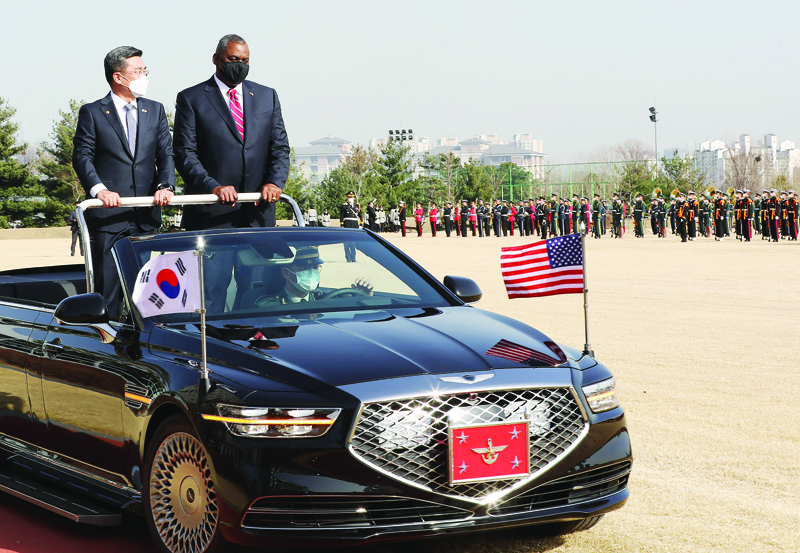 SEOUL: US Secretary of Defense Lloyd Austin (right) talks with South Korean Defense Minister Suh Wook (left) as they inspect honor guards during a welcoming ceremony at the Defense Ministry in Seoul yesterday.-AFPn