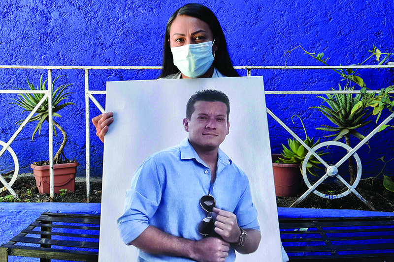 MEXICO CITY: Mexican doctor Yesenia Leyva and widow of Colombian doctor Christian Andres Cruz, poses with a picture of her husband, during an interview with AFP.-AFP n