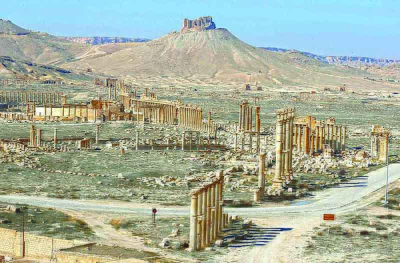 The Fakhr Al-Din II's citadel overlooks the ancient Roman-era city of Palmyra with a view of the Great Colonnade in Syria's central province of Homs.-AFP photosn