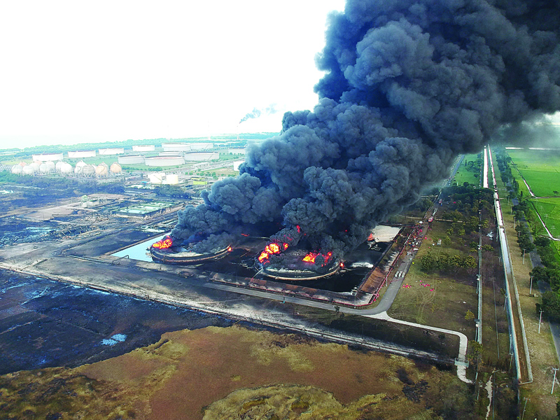 INDRAMAYU, Indonesia: This aerial photo shows the blaze raging on at Balongan refinery in Indramayu, West Java, operated by state oil company Pertamina, yesterday. -AFP n