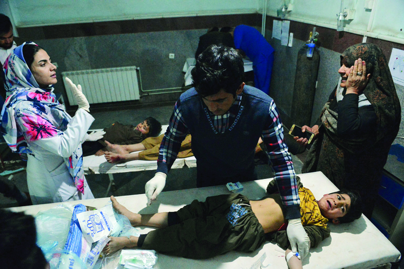 HERAT: Children wounded in a car bomb blast receive treatment at a hospital in Herat. ?AFPn