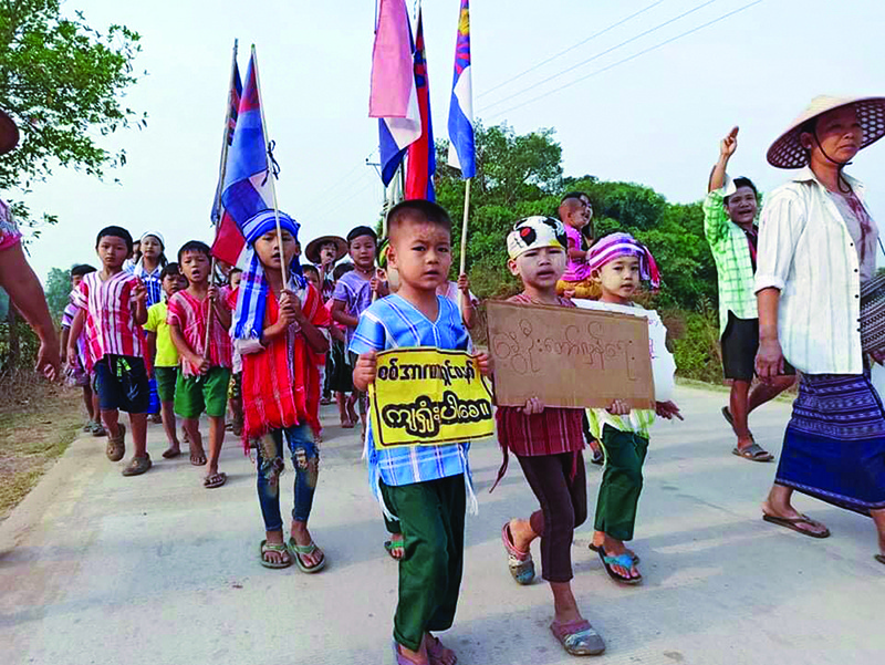 YANGON: This handout from Kawkareik Open News taken and released yesterday shows children taking part in a demonstration against the military coup in Kawkareik township in Myanmar's Karen state. - AFPn