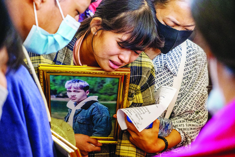 A relative cries during the funeral of a protester, who died amid a crackdown by security forces on demonstrations against the military coup, in Taunggyi in Myanmar's Shan state on Monday.-AFPn
