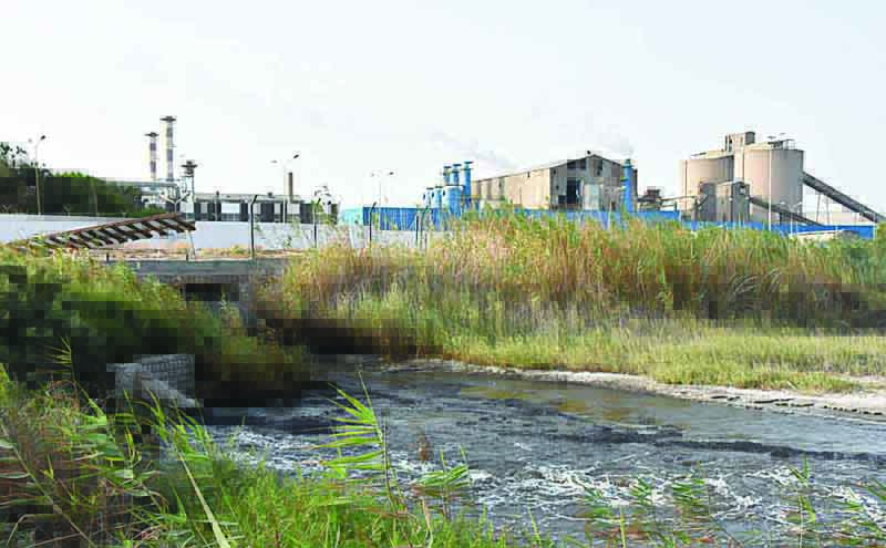 This file photo shows the state-owned Tunisian Chemical Group (GCT)'s phosphate processing plant close to the Chott Essalem beach and in front of a rare coastal oasis in Gabes. Tunisia's state-owned firms are in dire straits, pushed to the edge of ruin by a perfect storm of debt, mismanagement, the coronavirus-led downturn and a decade of political instability. - AFPn