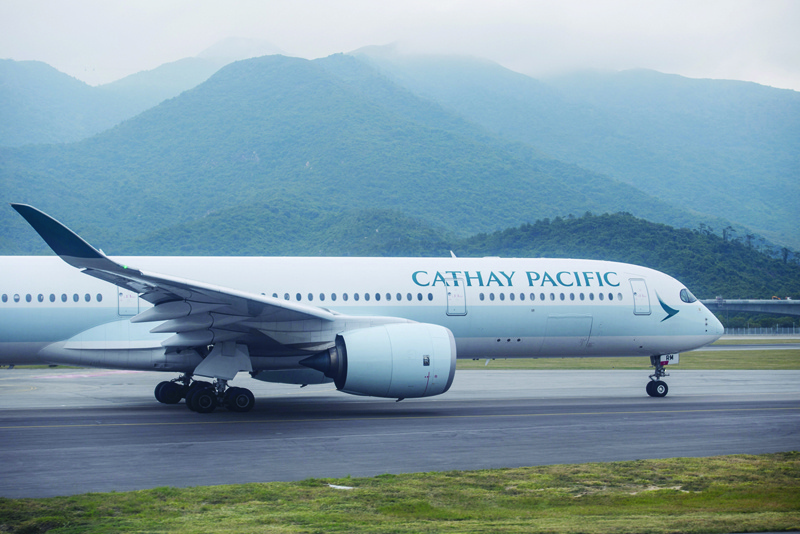 HONG KONG: A Cathay Pacific airlines passenger plane preparing to take off from the international airport in Hong Kong. Hong Kong carrier Cathay Pacific said yesterday it suffered a $2.8 billion loss in 2020 as the coronavirus pandemic hammered its business. - AFPn