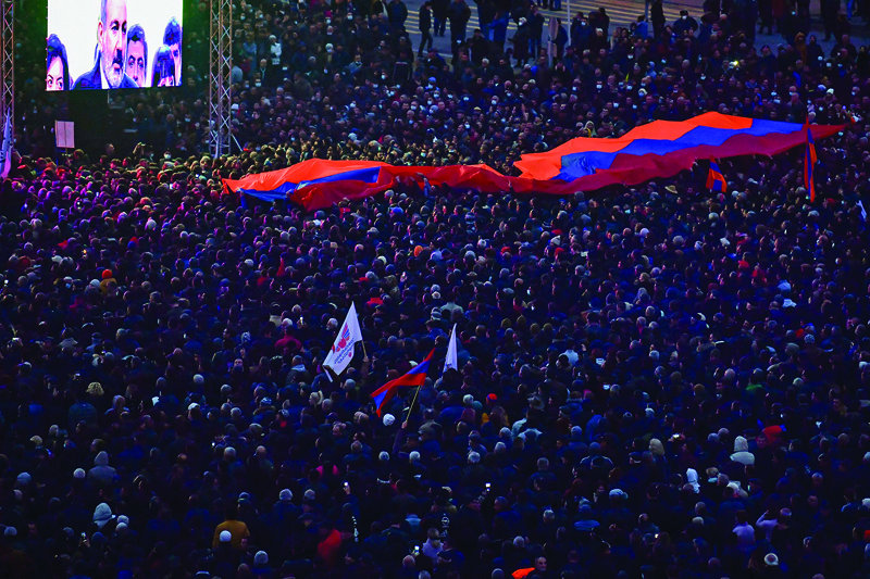 YEREVAN: Supporters of Armenian Prime Minister Nikol Pashinyan listen to his speech during a rally at Republic Square in downtown Yerevan.-AFP n