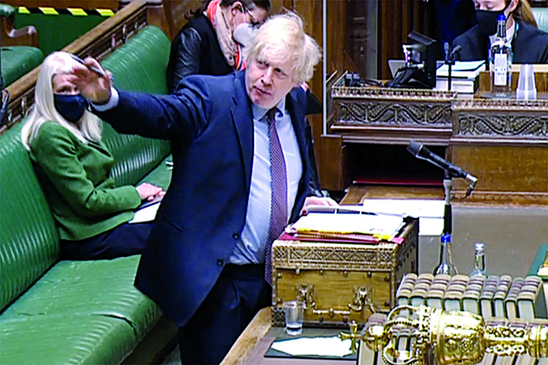 LONDON: A video grab from footage broadcast by the UK Parliament's Parliamentary Recording Unit (PRU) shows Britain's Prime Minister Boris Johnson taking part in the weekly Prime Minister's Questions (PMQs) at the House of Commons in London.-AFPn
