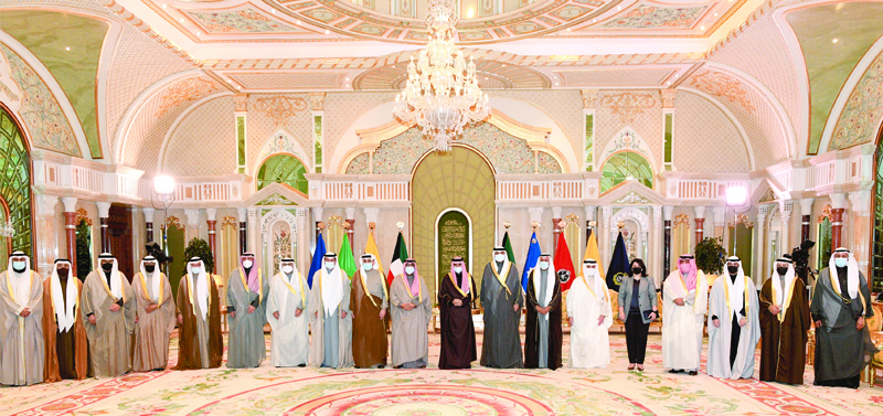 KUWAIT: HH the Amir Sheikh Nawaf Al-Ahmad Al-Jaber Al-Sabah and HH the Crown Prince Sheikh Mishal Al-Ahmad Al-Jaber Al-Sabah receive HH the Prime Minister Sheikh Sabah Al-Khaled Al-Hamad Al-Sabah and the new Cabinet members at Bayan Palace yesterday. - KUNAn