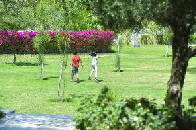 KUWAIT: Children play in Shadeed Park yesterday, a day before all public parks and recreational areas are set to be closed amid a spike in coronavirus cases in the country. - Photo by Fouad Al-Shaikhn