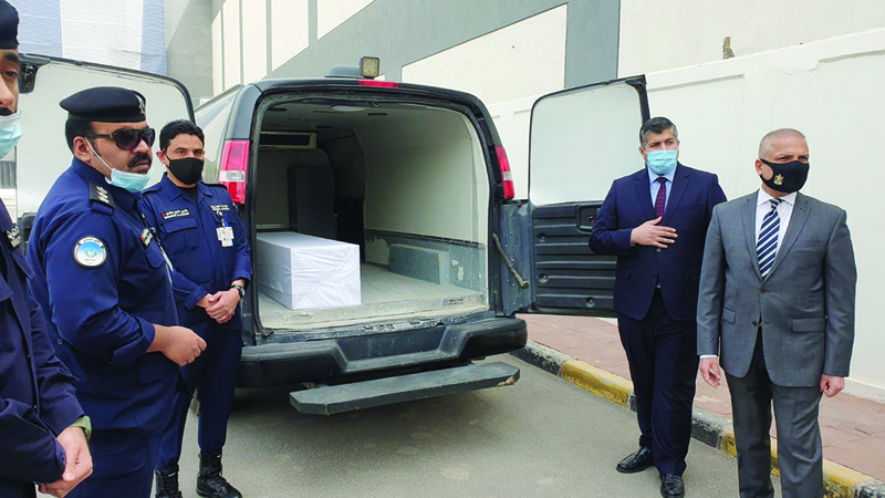 KUWAIT: The remains of a missing Iraqi are handed over to an Iraqi delegation yesterday. - KUNA 