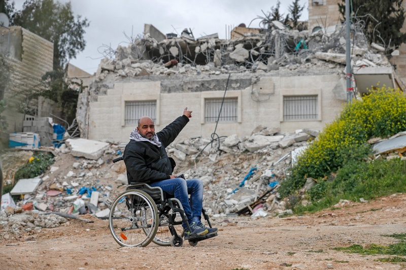 JERUSALEM: Palestinian Hatem Hussein Abu Rayala points at his house which was demolished again by Israeli forces in the neighborhood of Issawiya yesterday. - AFP n