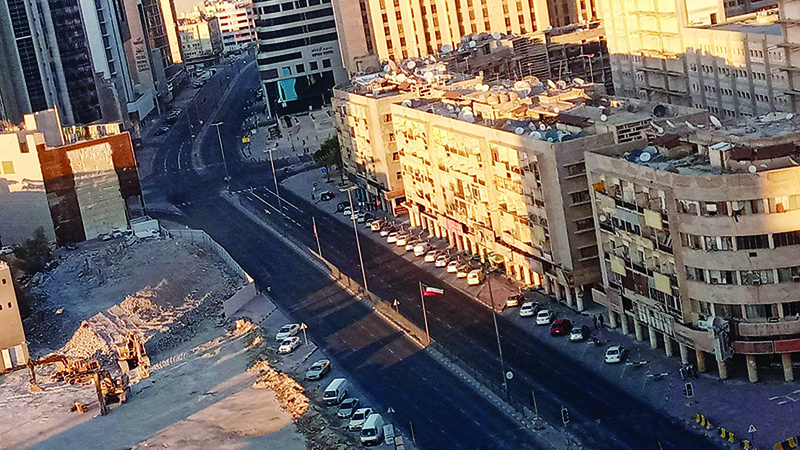 KUWAIT: Fahd Al-Salem St in Kuwait City is deserted yesterday as a nationwide curfew from 5 pm until 5 am is imposed for a month. — Photo by Yasser Al-Zayyat