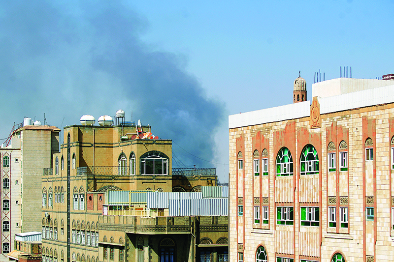 SANAA: Smoke billows following a reported airstrike by the Saudi-led coalition in the Yemeni capital yesterday. — AFP