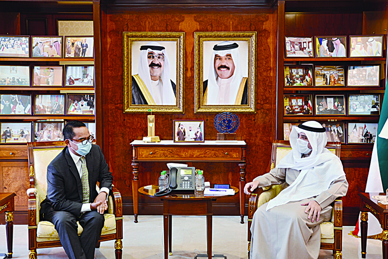 KUWAIT: Kuwait's Foreign Minister Sheikh Ahmad Nasser Al-Mohammad Al-Sabah meets outgoing Indonesia ambassador Tri Tharyat yesterday. - KUNA photosnn