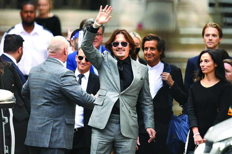 In this file photo US actor Johnny Depp (center) gestures as he leaves the High Court after the final day of his libel trial against News Group Newspapers (NGN), in London. -Afp photosn