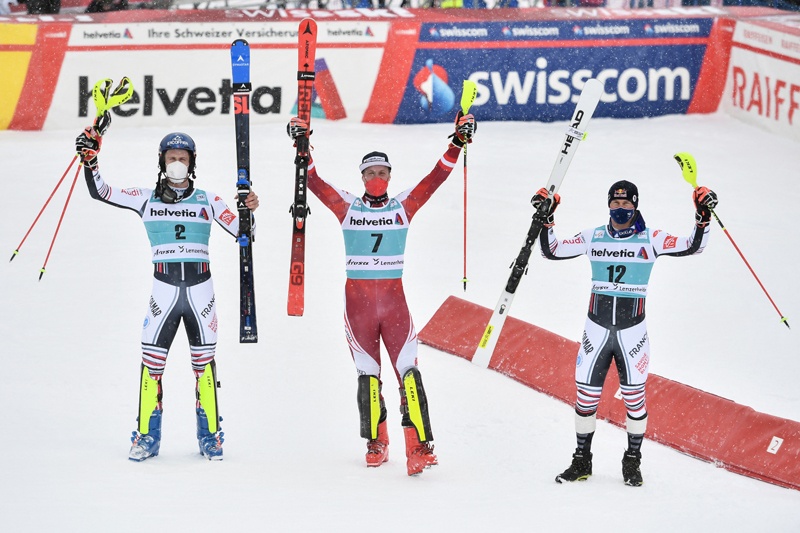 LENZERHEIDE: Second-placed France's Clement Noel, first-placed Austria's Manuel Feller and third-placed France's Alexis Pinturault pose for pictures in the finishing area after competing in the second run of the Men's Slalom event during the FIS Alpine ski World Cup in Lenzerheide yesterday. – AFPn