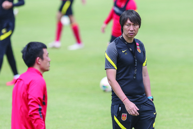SHANGHAI: In this file photo taken on May 25, 2020, China's head coach Li Tie (right) takes part in a training session with members of the Chinese national football team in Shanghai. - AFPn