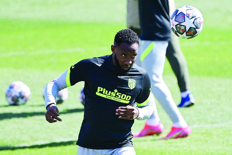 MAJADAHONDA: In this file photo taken on March 16, 2021 Atletico Madrid's French forward Moussa Dembele heads a ball during a training session at the club's training ground in Majadahonda on March 16, 2021, on the eve of the UEFA Champions League round of 16 second leg football match between Atletico Madrid and Chelsea. - AFPn