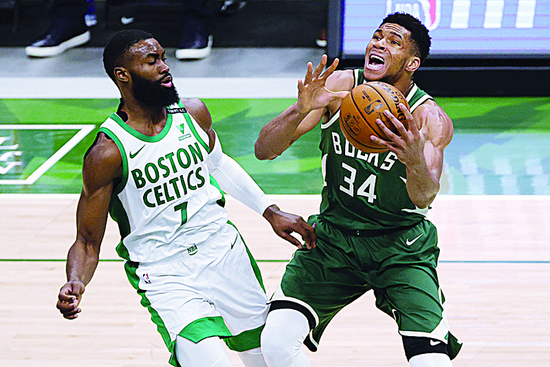 MILWAUKEE: Giannis Antetokounmpo #34 of the Milwaukee Bucks is defended by Jaylen Brown #7 of the Boston Celtics during the second half of a game at Fiserv Forum on Wednesday. - AFP n
