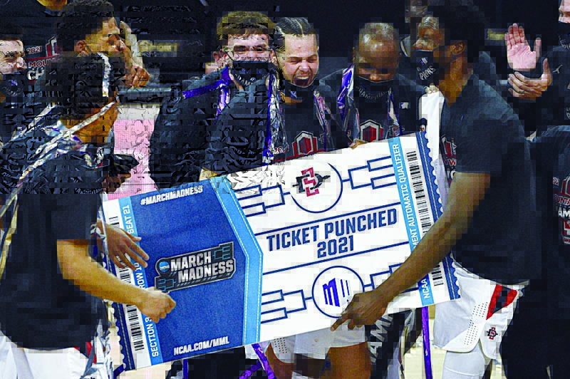 LAS VEGAS: The San Diego State Aztecs celebrate their 68-57 victory over the Utah State Aggies in the championship game of the Mountain West Conference basketball tournament at the Thomas & Mack Center on March 13, 2021 in Las Vegas, Nevada. - AFPn