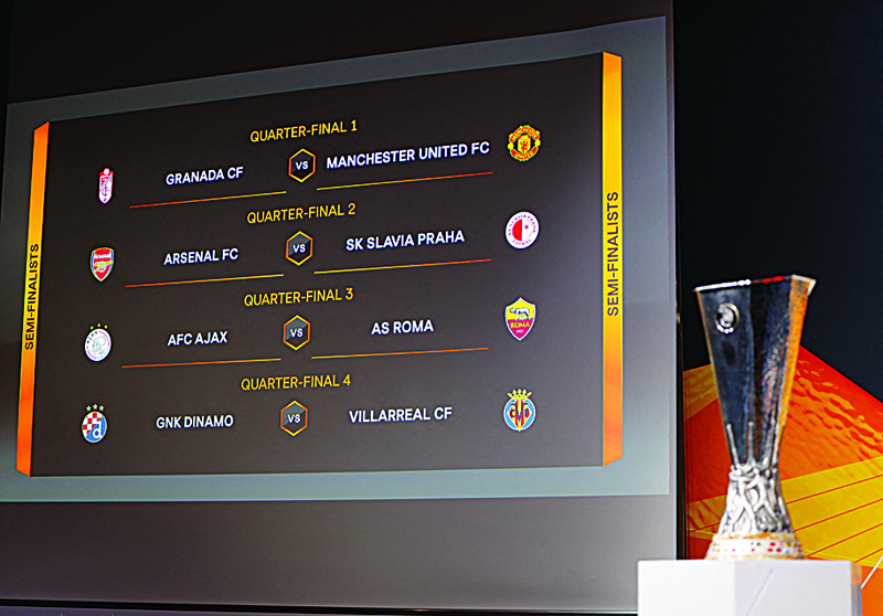 NYON: This handout picture taken and made available on Friday by the Union of European Football Associations (UEFA), shows the quarter-final draw results as shown on a big screen following the UEFA Europa League quarter-finals and semi-finals draw at the UEFA headquarters in Nyon. - AFPn
