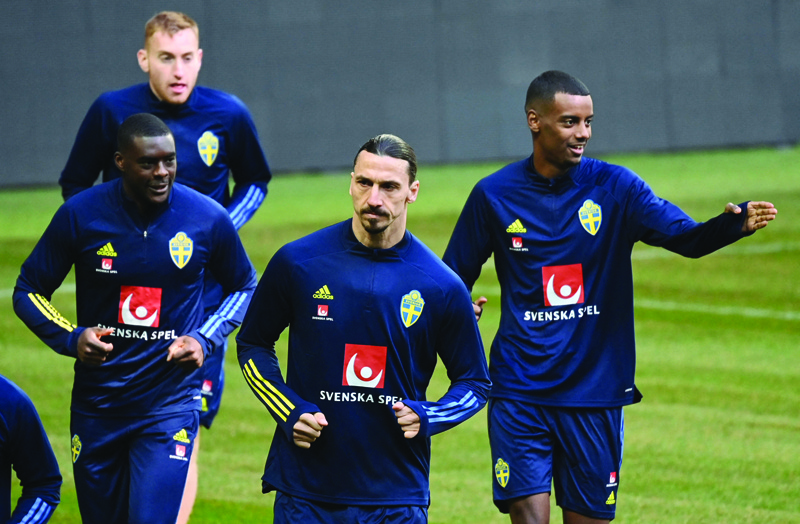 STOCKHOLM: Zlatan Ibrahimovic (second right), forward of Sweden's national football team, attends a training session with teammates yesterday in Stockholm, prior to the World Cup qualifier of Sweden vs Georgia to be played tomorrow. - AFPn