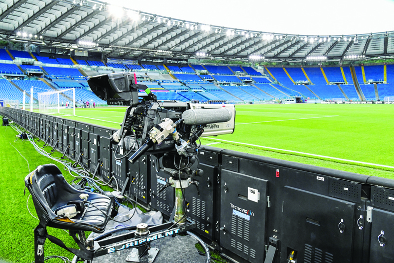 ROME: In this file photo taken on June 27, 2020 a general view shows a television broadcast camera and empty tribunes prior to the Italian Serie A football match Lazio vs Fiorentina at the Olympic stadium in Rome. - AFPn