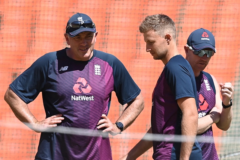 AHMEDABAD: England's team captain Joe Root (center) walks past head coach Chris Silverwood (left) during a practice session ahead of the fourth Test cricket match between India and England at the Narendra Modi Stadium in Motera yesterday. - AFPn
