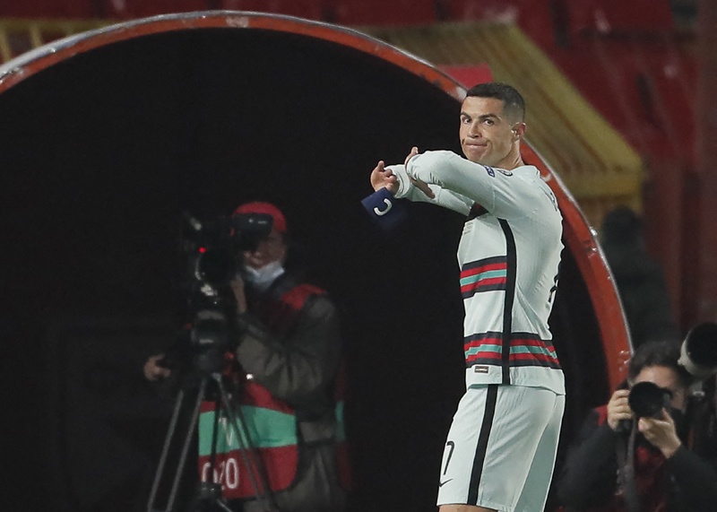BELGRADE: Portugal's forward Cristiano Ronaldo holds his captain armband moments before he threw it to the ground and left the pitch at the end of the FIFA World Cup Qatar 2022 qualification Group A football match between Serbia and Portugal at the Rajko Mitic Stadium, in Belgrade, on Saturday. – AFPn