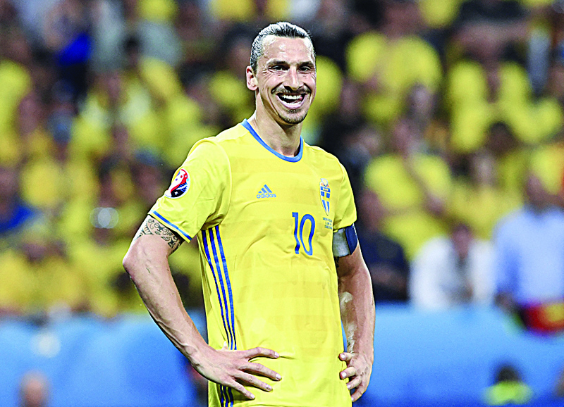 NICE: In this file photo taken on June 22, 2016 Sweden's forward Zlatan Ibrahimovic grimaces during the Euro 2016 group E football match between Sweden and Belgium at the Allianz Riviera stadium in Nice. - AFPn