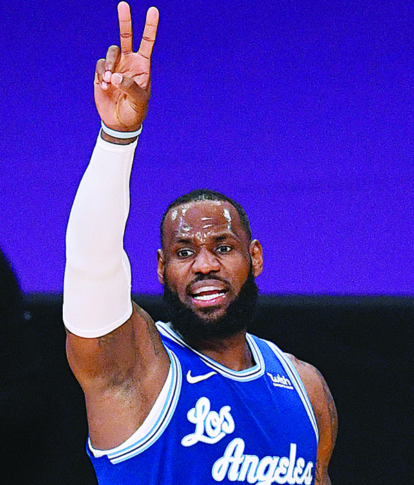LOS ANGELES: LeBron James of the Los Angeles Lakers calls a play during the third quarter against the Minnesota Timberwolves at Staples Center on Tuesday in Los Angeles, California. - AFPn