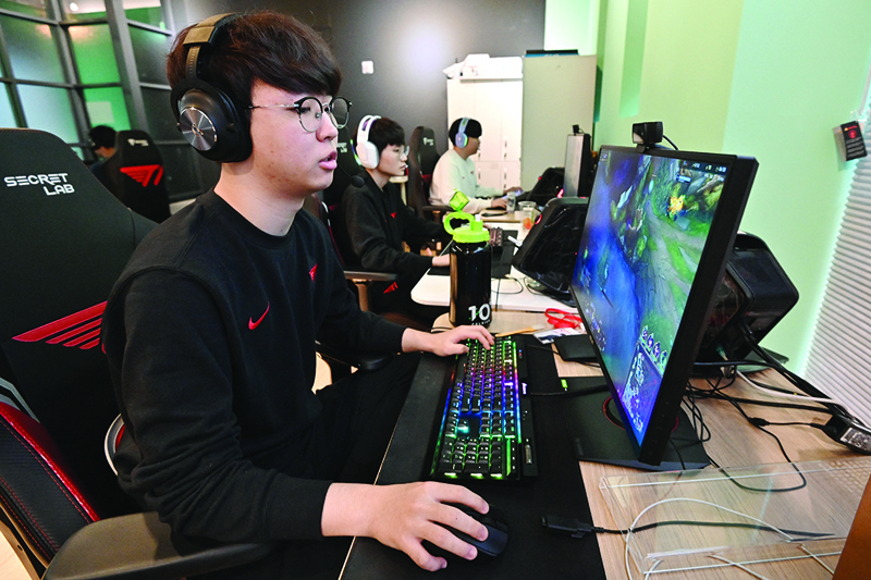 SEOUL: This picture taken on February 25, 2021 shows gamers during their training session at the T1 building, one of the world's top eSports organizations where dozens of professional and budding gamers train, in Seoul. - AFPn