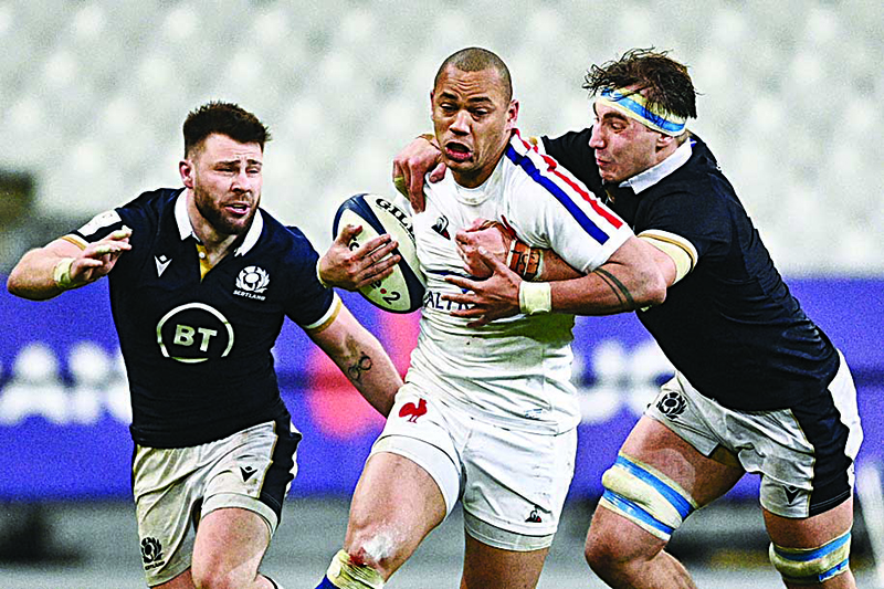 SAINT-DENIS: France’s wing Gael Fickou (center) is tackled by Scotland’s flanker Jamie Ritchie (right) and Scotland’s scrum-half Ali Price (left) during the Six Nations rugby union tournament match between France and Scotland on Friday, at the Stade de France in Saint-Denis, outside Paris. —AFP