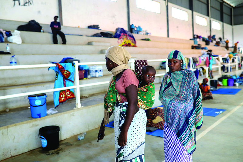 Internally displaced women (IDP) from Palma are seen at the Pemba Sports center in Pemba. - AFPn