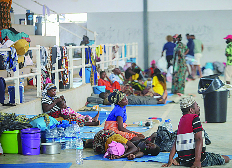 Internally displaced people (IDP) from Palma gather in the Pemba Sports center to receive humanitarian aid in Pemba. They people were evacuated from the coasts of Palma after armed insurgents attacked the city on March 24, 2021.-AFPn