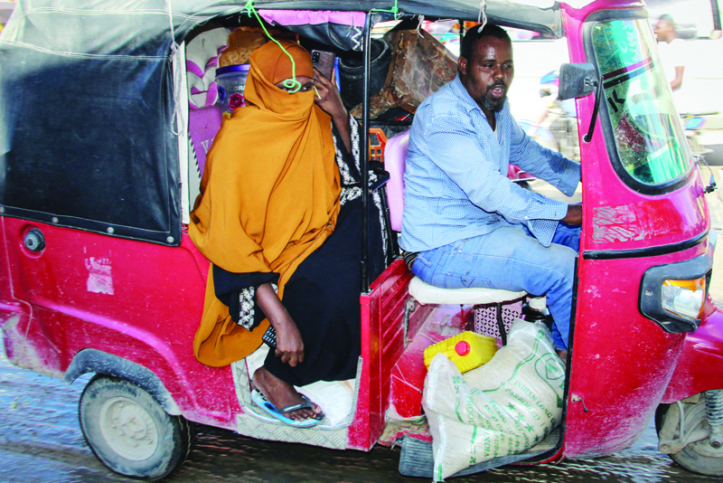 MOGADISHU: Residents start to flee from their home after recent crashes between the Somali security forces and the Somali military force supporting anti-government opposition leaders erupted over the president's bid to extend his mandate yesterday.-AFPn