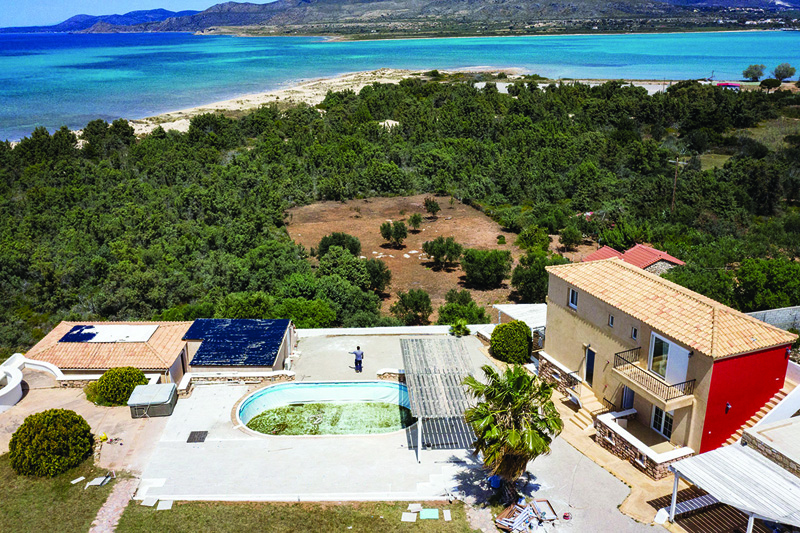 A photo shows a view of a hotel under renovation on the small southern Greek island of Elafonisos.-AFP photosn