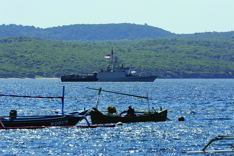 Indonesian navy ships arrive at the naval base in Banyuwangi yesterday to join in the search for a decades-old navy submarine that went missing off the coast of Bali with 53 crew aboard during regular exercises. -- AFPn