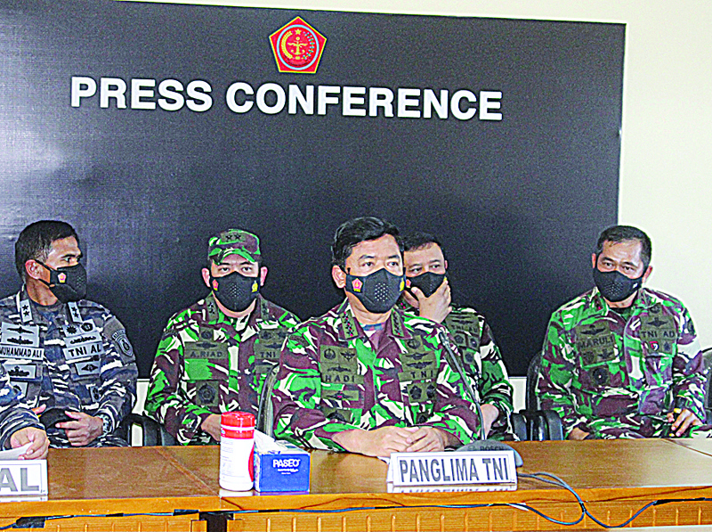 DENPASAR: Indonesian military chief Hadi Tjahjanto (center) speaks during a press conference in Denpasar yesterday as search operations continued off the coast of Bali for the Navy's KRI Nanggala (402) submarine that went missing on April 21 during a training exercise. - AFPn